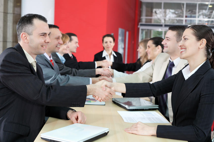 People shaking hands on business meeting